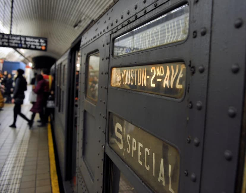 Close up of a vintage subway car at a station platform, showing destination signs for 'HOUSTON-2ND AVE' and 'S SPECIAL'.