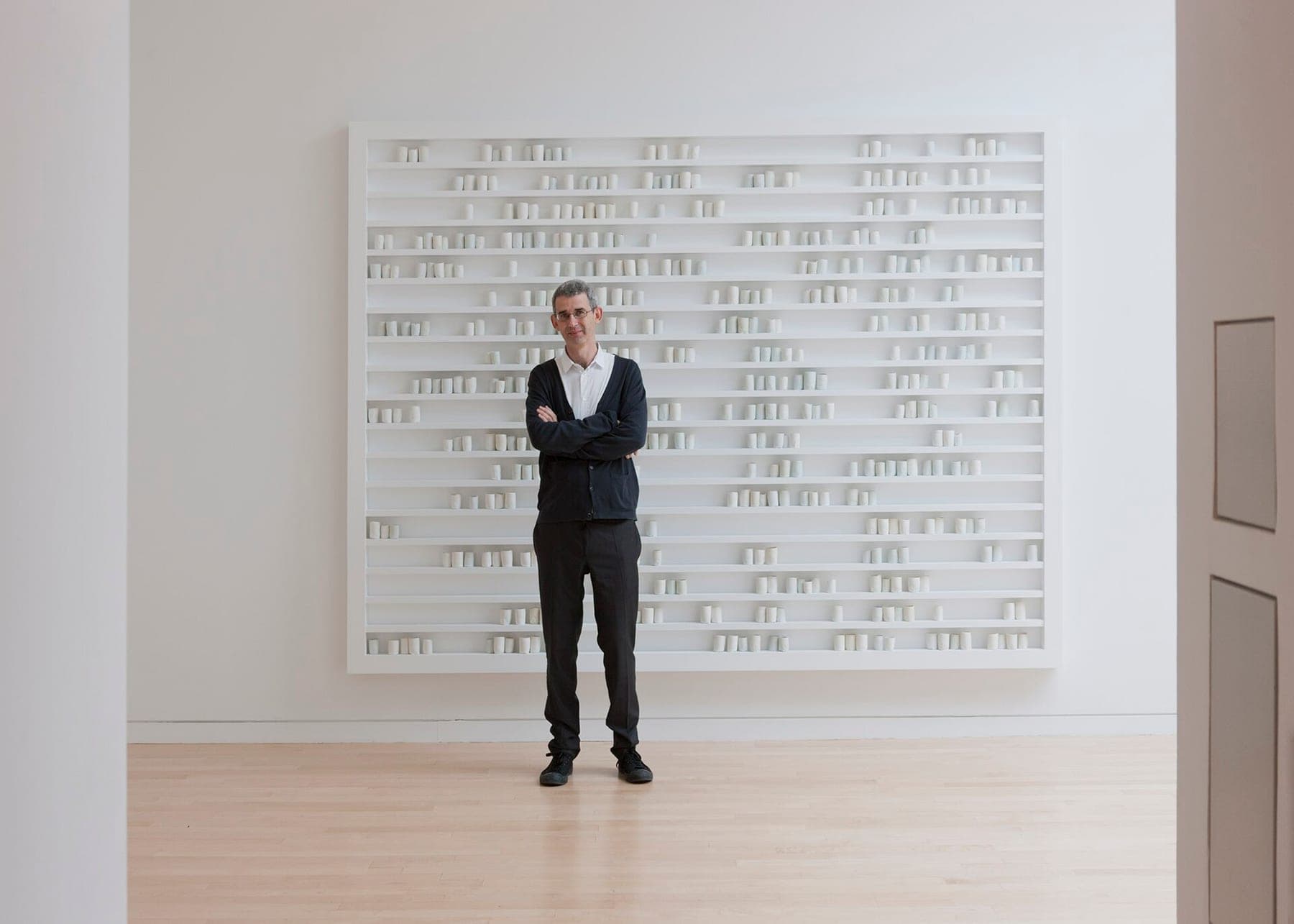 Edmund de Waal with his installation, breathturn (2013), at Gagosian, New York
